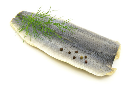herring fillets on a white backgroundの写真素材