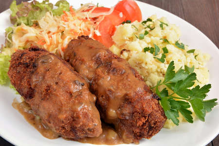 minced cutlets with potatoes and salad