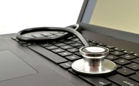 stethoscope on the laptop keyboardの写真素材