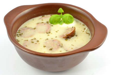 sour rye soup with egg and sausageの写真素材