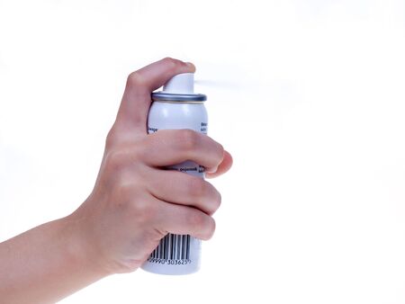 Hand with spray, isolated on white backgroundの写真素材