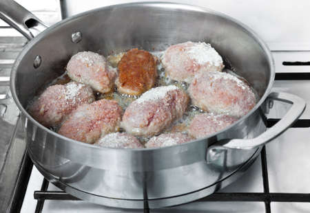 Raw veal chops on the pan の写真素材