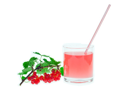 Fruit juice and red currant on kitchen tableの写真素材