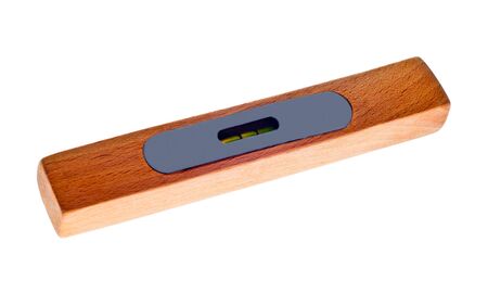 Old brown wooden spirit level on a white background