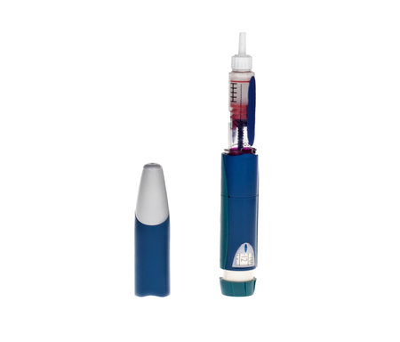 A single diabetic insulin pen dispenser, isolated on a white background.のeditorial素材