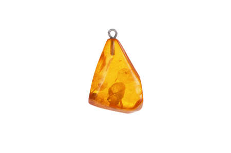 Vintage amber pendant on white background closeupの写真素材