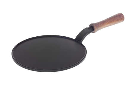 Old empty cast iron frying pan isolated on white backgroundの写真素材