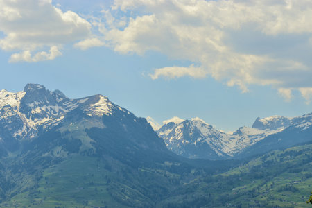 View to the wonderful snow covered alps in Switzerland seen from Eschen in Liechtenstein 24.4.2020の写真素材