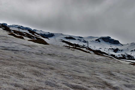 Snow on top of the alps at the Klausenpass in Switzerland 8.5.2020