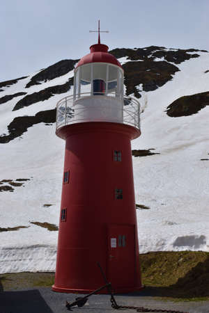 Pretty red lighthouse on top of the Oberalppass in Switzerland 8.5.2020の写真素材