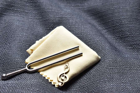 Presentation of a tuning fork and clef for music artists 12.5.2020の写真素材