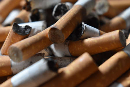 Ashtray overloaded with used cigarettes 12.5.2020の写真素材