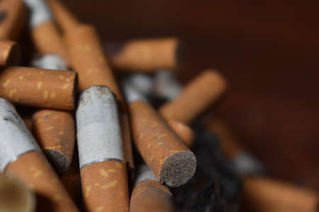 Ashtray overloaded with used cigarettes 12.5.2020の写真素材