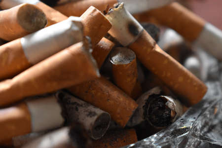 Ashtray overloaded with used cigarettes 12.5.2020の写真素材
