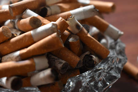 Ashtray overloaded with used cigarettes 12.5.2020の写真素材