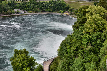 Rhine river flows its way ahead after passing the falls near Schaffhausen in Switzerland 20.5.2020の写真素材