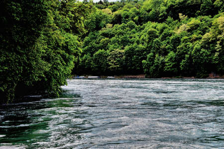 Rhine river flows its way ahead after passing the falls near Schaffhausen in Switzerland 20.5.2020の写真素材