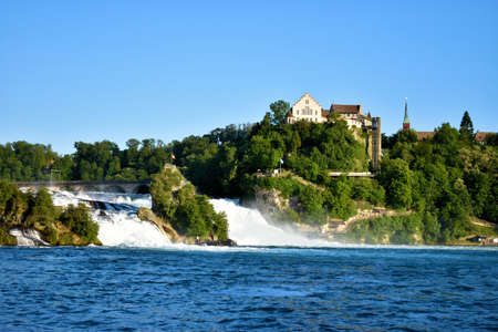 Historic old castle on a hill at the rhine falls in Switzerland 20.5.2020