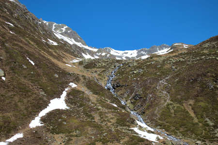Breathtaking alpine countryside at the Fluelapass in Switzerland 27.5.2020の写真素材