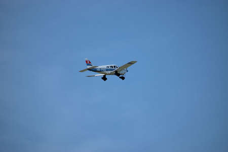 Spotting a Piper Archer airplane during take off at the aerodrome Saint Gallen Altenrhein in...