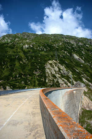 Wall of an alpine reservoir on top of the Lukmanierpass in Switzerland 30.7.2020の写真素材