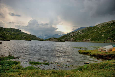Upcoming storm over the alpine lake on top of the San Bernardinopass in Switzerland 30.7.2020の写真素材
