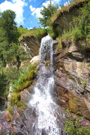 Idyllic little cascade in the mountains in Vals in Switzerland 31.7.2020の写真素材