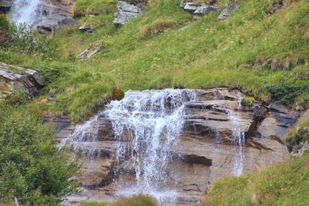 Idyllic little cascade in the mountains in Vals in Switzerland 31.7.2020の写真素材