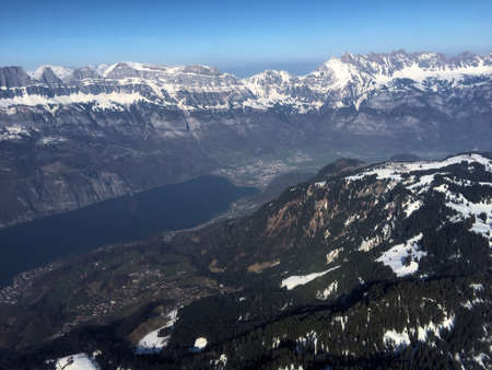 Flight over the snow covered alps in the area of Flums in Switzerland 20.3.2016