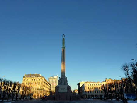 Sculpture under a blue sky on a square in the city of Riga in Latvia 28.12.2015