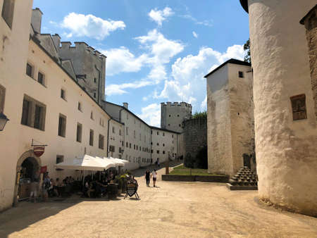 People are visiting the historic old castle in the city of Salzburg in Austria 10.6.2018のeditorial素材