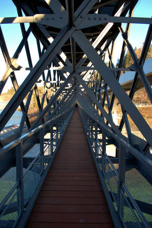 Fascinating walkway under a specific bridge construction over the rhine river in Tamins in Switzerland 20.2.2021のeditorial素材