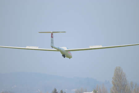 Glidre airplane is circling around the airport Saint Gallen Altenrhein in Switzerland 21.4.2021のeditorial素材
