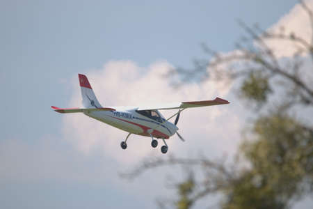 Tecnam P2008JC aircraft is approaching the airport Saint Gallen Altenrhein in Switzerland 21.4.2021のeditorial素材