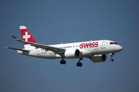 Swiss Bombardier CS 100 aircraft on the final approach to the international airport in Zurich in...