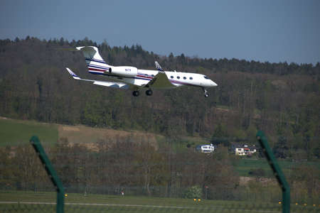 Gulfstream G 650 aircraft on the final approach to the international airport in Zurich in...
