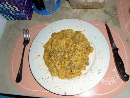 Homemade pasta with melted cheese on a plateのeditorial素材