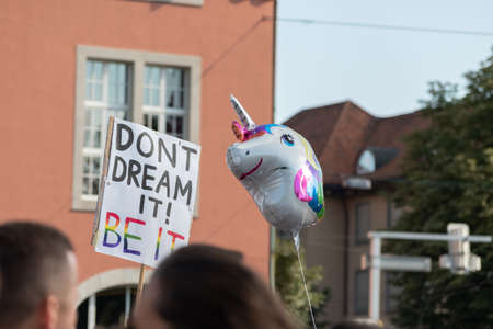 ZURICH, SWITZERLAND, SEPTEMBER 4, 2021 Protesters with an unicorn balloon at the gay pride demo in...