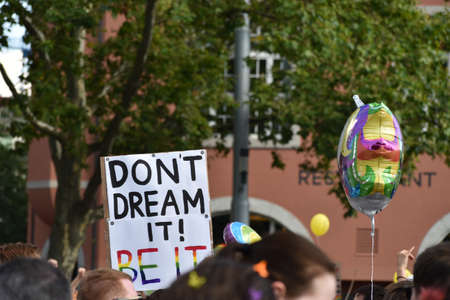ZURICH, SWITZERLAND, SEPTEMBER 4, 2021 Protesters in the city center holding up their sign with a...