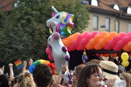 ZURICH, SWITZERLAND, SEPTEMBER 4, 2021 Protesters with an unicorn balloon at the gay pride demo in...