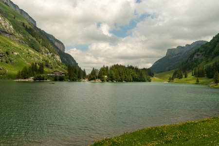 Appenzell, Switzerland, June 13, 2021 Incredible panorama at the lake Seealpsee between an idyllic alpine sceneryの写真素材