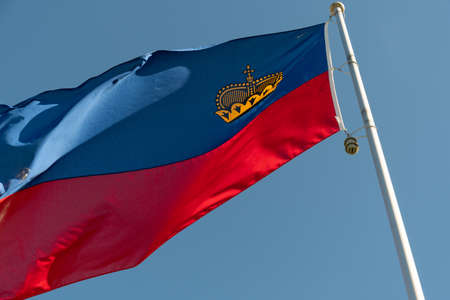 Vaduz, Liechtenstein, October 11, 2021 National flag of the Liechtenstein country is waving in the windの写真素材