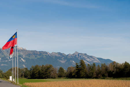 Vaduz, Liechtenstein, October 11, 2021 View over an arable field in front of the alps on a sunny day