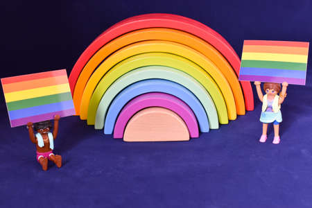 Vaduz, Liechtenstein, October 15, 2021 Rainbow with two human toys holding up a gender flagのeditorial素材