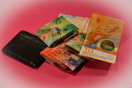 Vaduz, Liechtenstein, November 22, 2021 Swiss francs in cash in a walletの写真素材