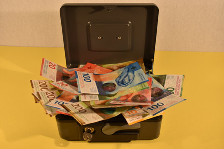 Vaduz, Liechtenstein, November 22, 2021 Some bills in the swiss currency in a saving boxの写真素材