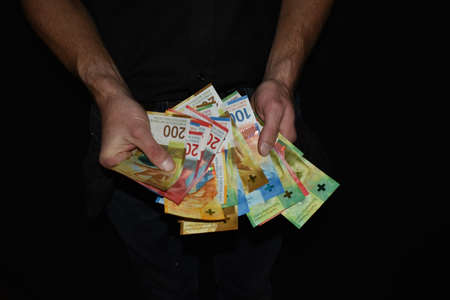 Vaduz, Liechtenstein, November 22, 2021 Different money bills in the swiss currencyの写真素材