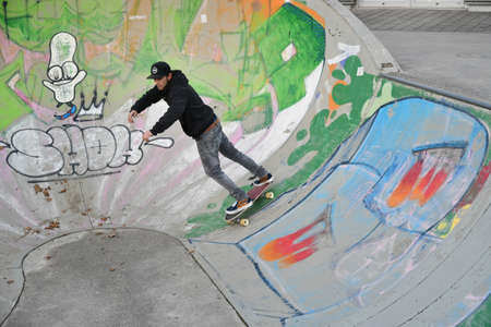 Vaduz, Liechtenstein, November 19, 2021 Guy on a skateboard is performing some cool movesのeditorial素材