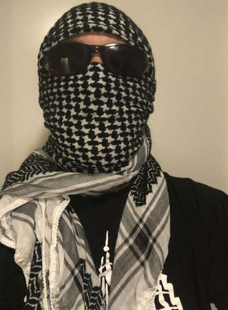 Vaduz, Liechtenstein, October 20, 2020 Person with a traditional oriental scarf and sunglasses
