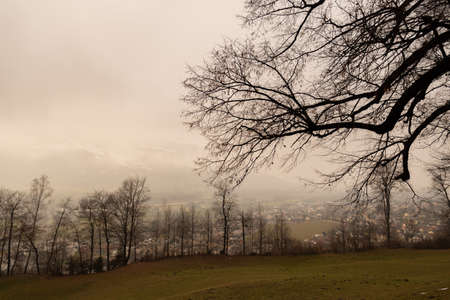 Vaduz, Liechtenstein, December 14, 2021 View over the rhine valley on a foggy day and the hidden...